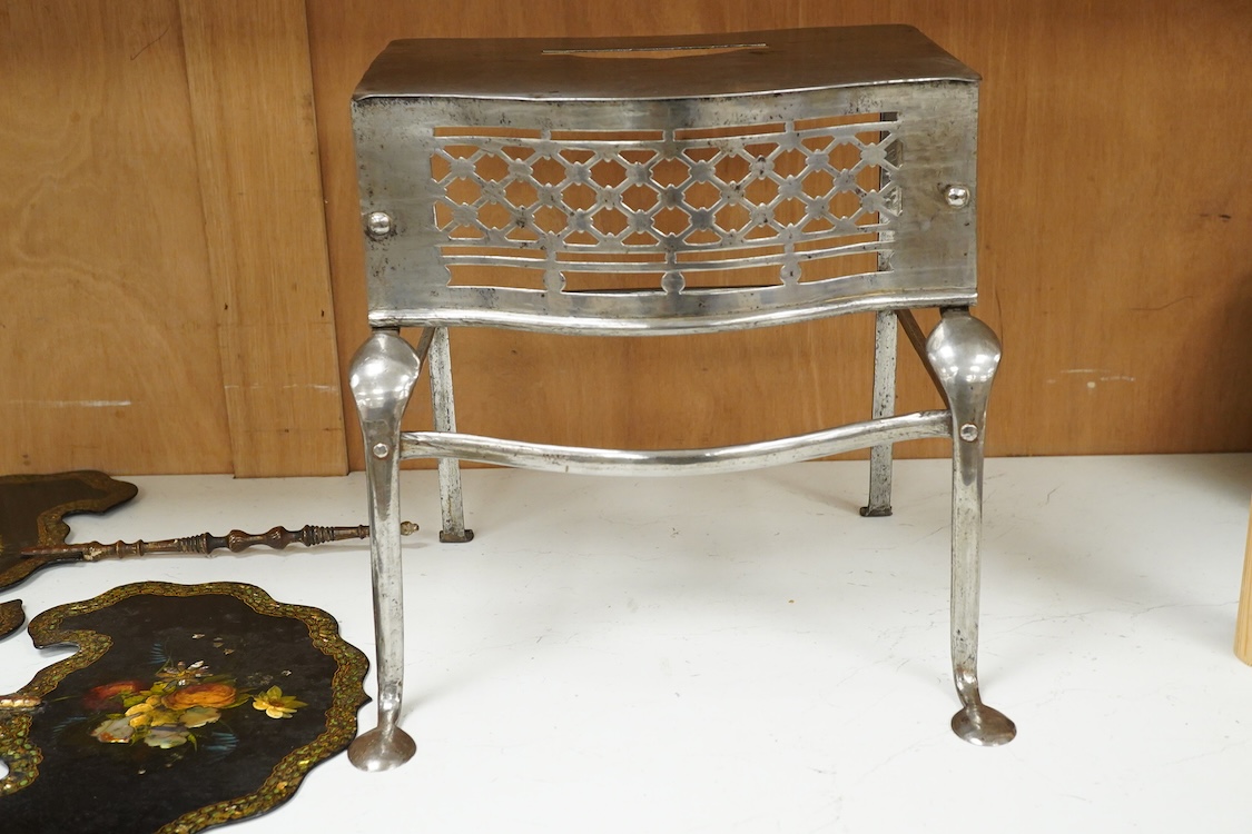 Two late Georgian pierced steel footman, 29cm high